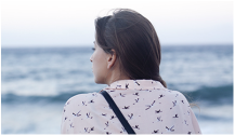 Woman looking out to sea. Link to Dee Murray Therapies blog post - TAPPING INTO WEALTH COACHING FOR WOMEN ENTREPRENEURS