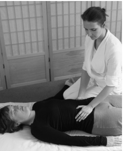 photo of Shiatsu treatment on abdomen with Maria Shlumukova for Edinburgh Shiatsu